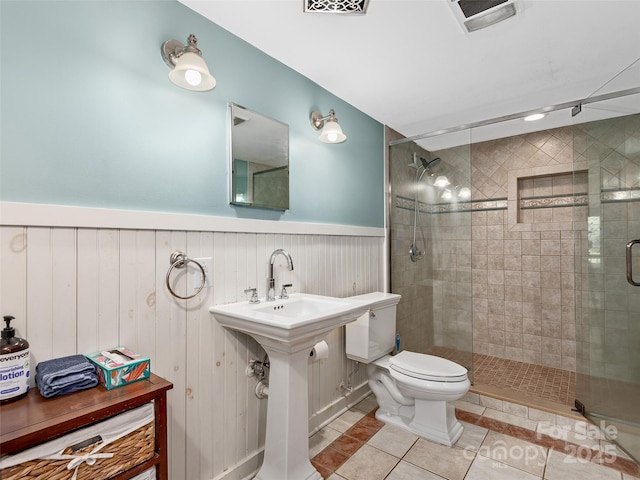 221 Holland Dr, Black Mountain, NC 28711 - full bath with tile patterned flooring, a wainscoted wall, toilet, and a shower stall