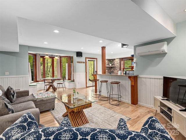 221 Holland Dr, Black Mountain, NC 28711 - living room featuring recessed lighting, light wood-style flooring, wainscoting, and a wall mounted AC