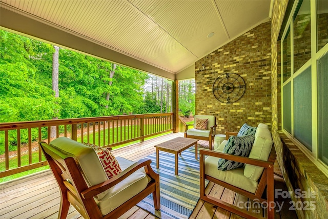wooden terrace featuring an outdoor living space