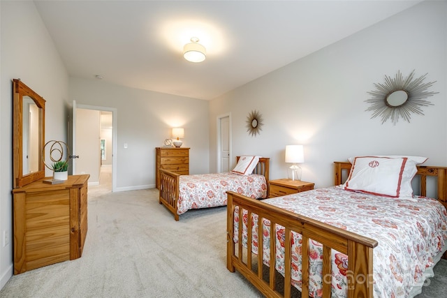 bedroom with carpet flooring and baseboards