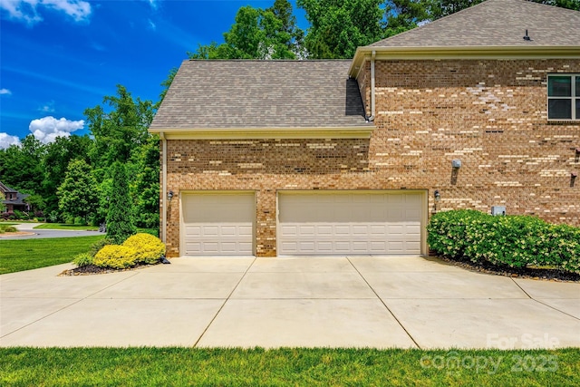 view of property exterior with concrete driveway, brick siding, a shingled roof, and a garage