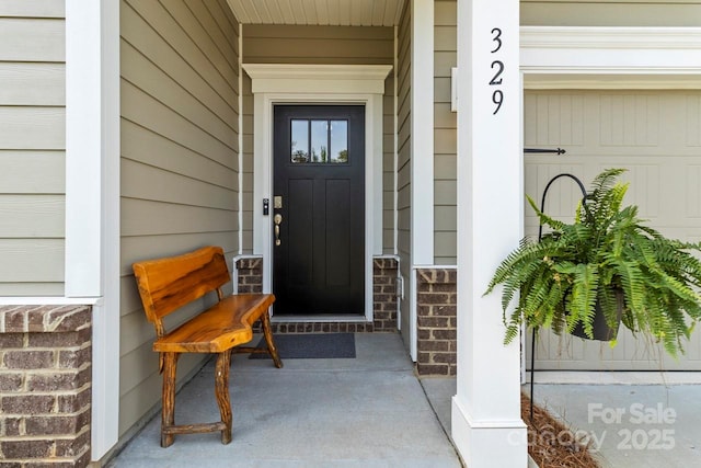 doorway to property featuring a porch