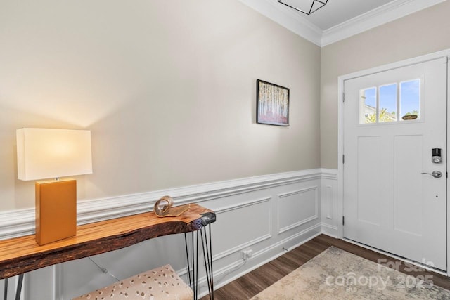 entrance foyer with a wainscoted wall, ornamental molding, and dark wood-type flooring
