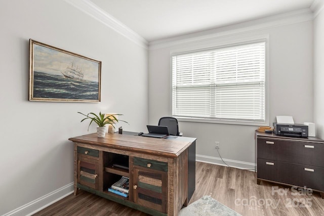 home office featuring crown molding, baseboards, and wood finished floors