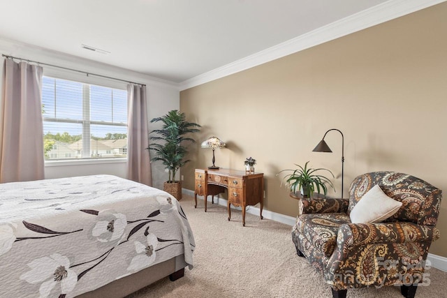 carpeted bedroom with visible vents, baseboards, and crown molding