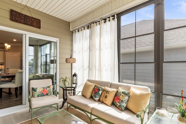 sunroom / solarium featuring outdoor lounge area