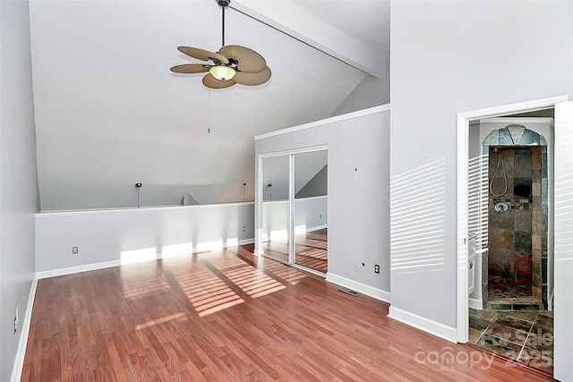 bonus room featuring lofted ceiling with beams, a ceiling fan, baseboards, wood finished floors, and visible vents