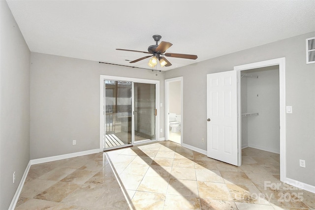 13932 Queens Harbor Rd, Charlotte, NC 28278 - spare room with a ceiling fan and baseboards