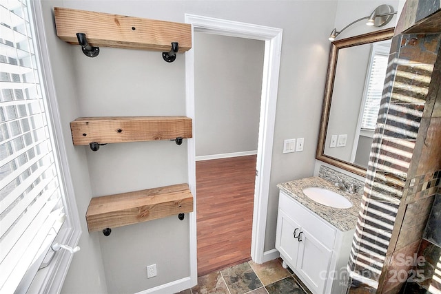 13932 Queens Harbor Rd, Charlotte, NC 28278 - bathroom with vanity and baseboards
