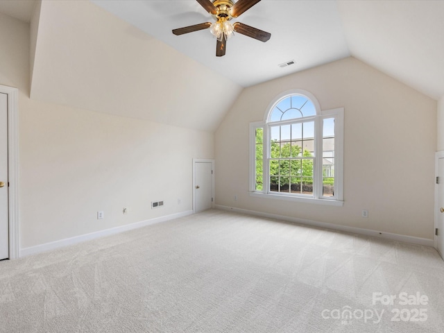 bonus room with carpet floors, baseboards, vaulted ceiling, and visible vents