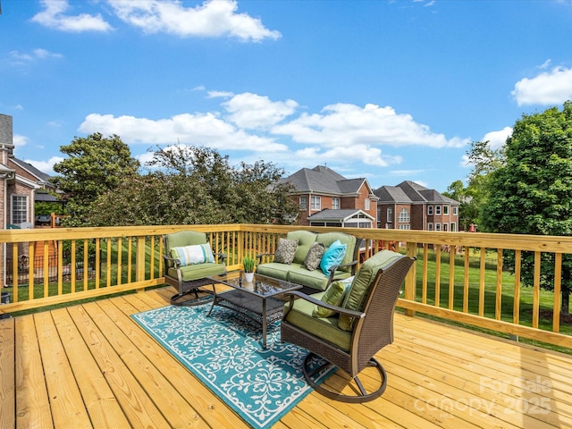 wooden terrace with a residential view and outdoor lounge area