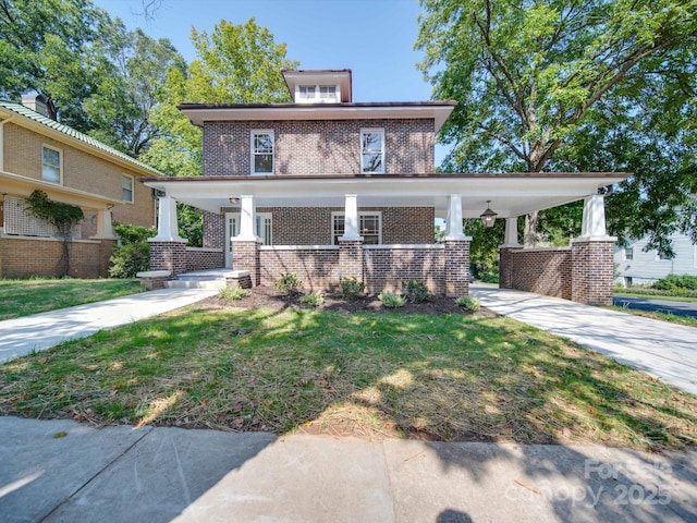 traditional style home with a porch, brick siding, and concrete driveway