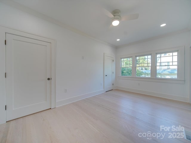 empty room featuring recessed lighting, baseboards, ceiling fan, and light wood finished floors