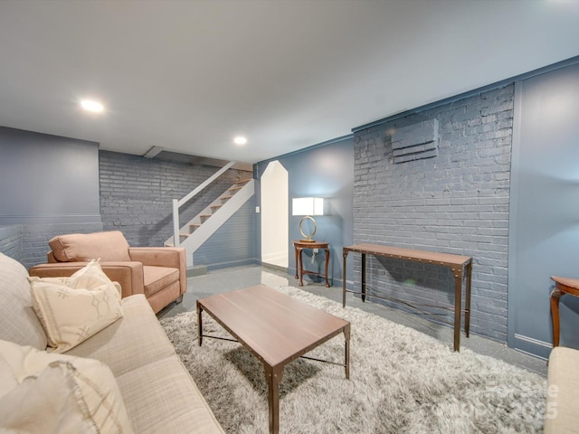 living room featuring recessed lighting, baseboards, and stairway
