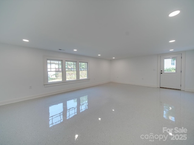 interior space featuring baseboards and recessed lighting