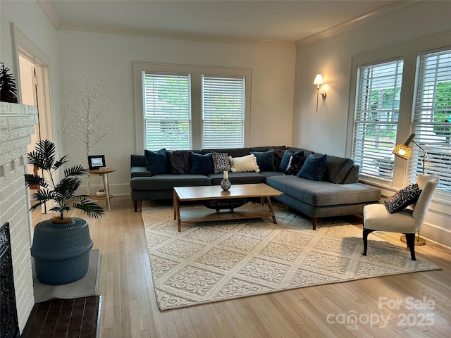 300 W Thomas St, Salisbury, NC 28144 - living room featuring light wood-style floors, crown molding, baseboards, and a brick fireplace