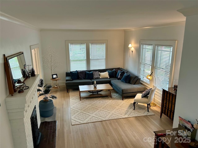 300 W Thomas St, Salisbury, NC 28144 - living area featuring a brick fireplace, ornamental molding, and light wood-style flooring