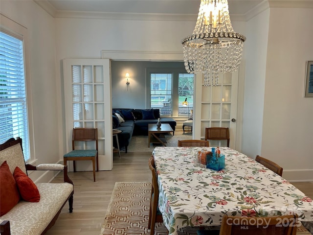 300 W Thomas St, Salisbury, NC 28144 - dining space featuring an inviting chandelier, baseboards, ornamental molding, and light wood-type flooring