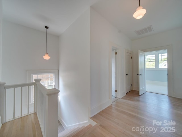 300 W Thomas St, Salisbury, NC 28144 - hallway featuring visible vents, light wood-style flooring, baseboards, and an upstairs landing