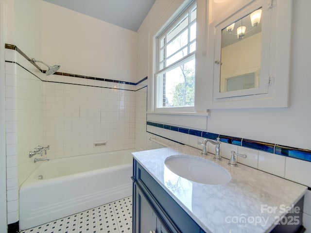 300 W Thomas St, Salisbury, NC 28144 - bathroom with shower / washtub combination, tile walls, and vanity