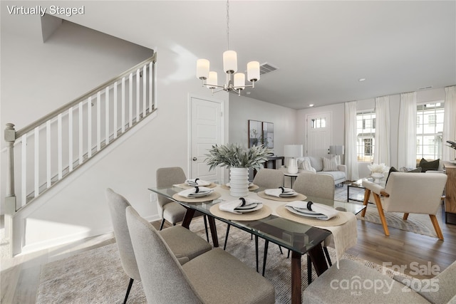8114 Jacey Ln Unit 21, Huntersville, NC 28078 - dining space featuring visible vents, an inviting chandelier, wood finished floors, stairway, and recessed lighting