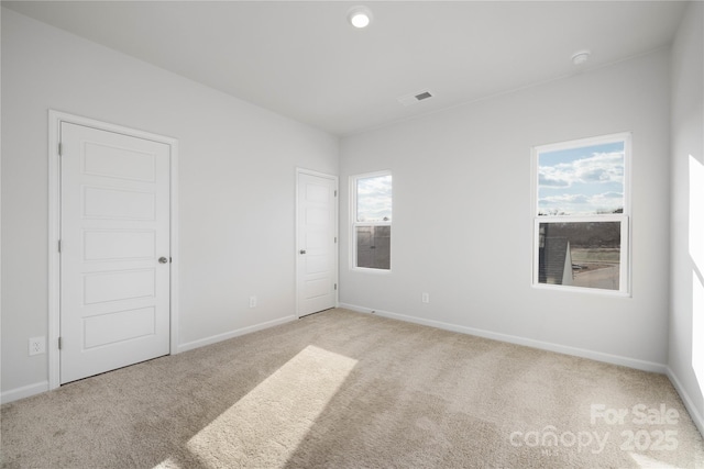 8114 Jacey Ln Unit 21, Huntersville, NC 28078 - spare room with carpet floors, baseboards, and visible vents