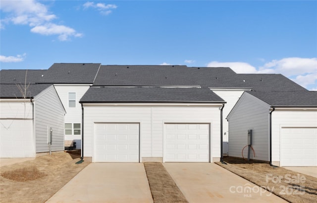 8114 Jacey Ln Unit 21, Huntersville, NC 28078 - back of house with concrete driveway and a garage