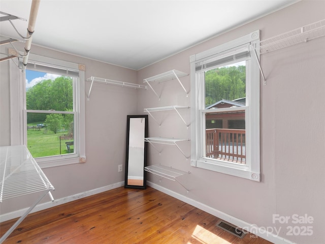 819 Mauney Cove Rd, Waynesville, NC 28786 - walk in closet featuring hardwood / wood-style floors and visible vents