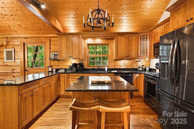 1415 Little River Campground Rd, Pisgah Forest, NC 28768 - kitchen featuring fridge with ice dispenser, range with gas stovetop, stainless steel microwave, a sink, and a peninsula