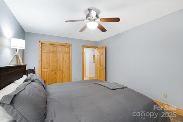 1415 Little River Campground Rd, Pisgah Forest, NC 28768 - bedroom with a closet, ceiling fan, and wood finished floors