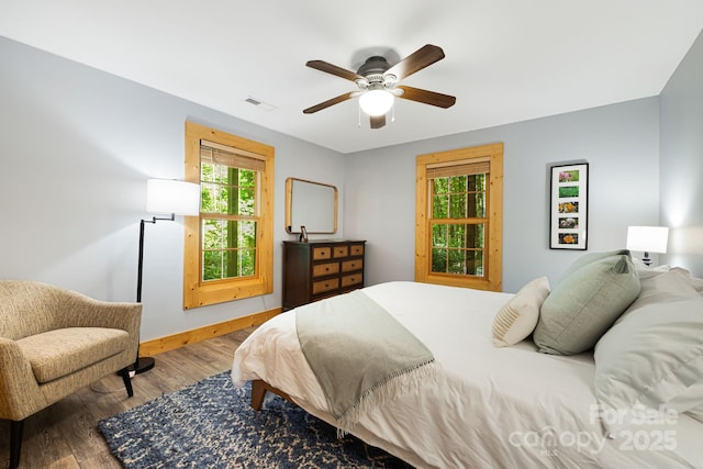 1415 Little River Campground Rd, Pisgah Forest, NC 28768 - bedroom featuring wood finished floors, baseboards, and a ceiling fan