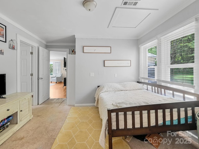 bedroom featuring crown molding, visible vents, baseboards, attic access, and light colored carpet
