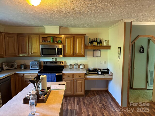 kitchen featuring light countertops, appliances with stainless steel finishes, and open shelves