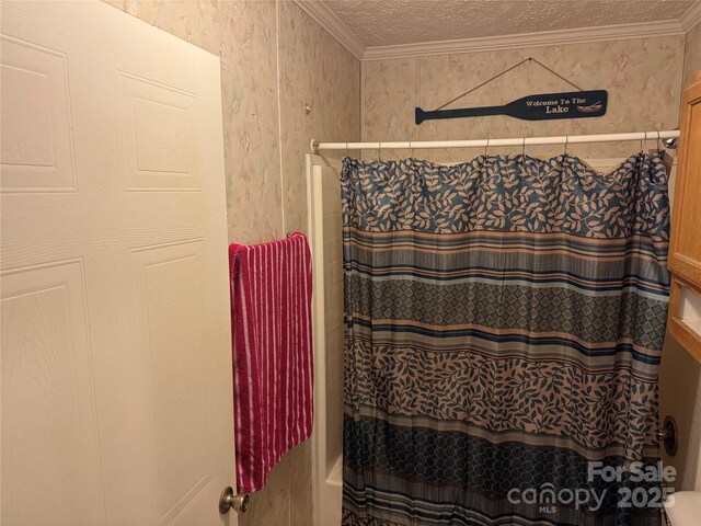 full bath featuring ornamental molding and a textured ceiling