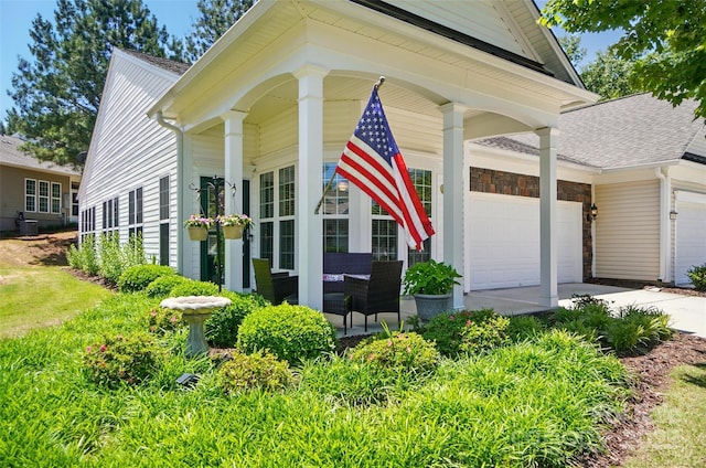 9003 Smokey Hill Ln, Fort Mill, SC 29707 - view of property exterior featuring driveway, covered porch, a garage, central AC unit, and roof with shingles