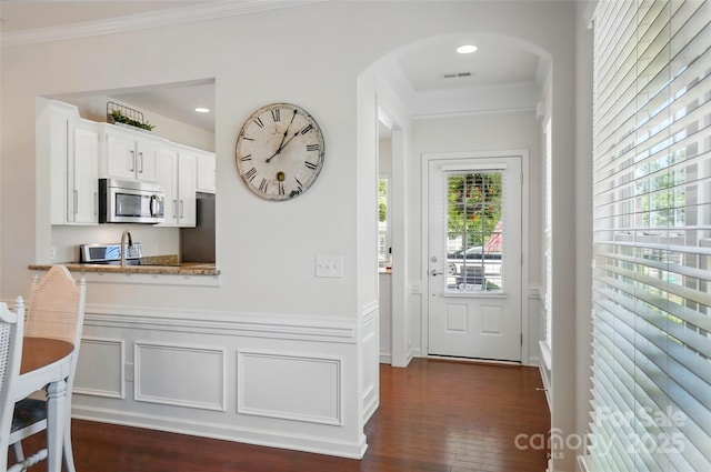 9003 Smokey Hill Ln, Fort Mill, SC 29707 - doorway with arched walkways, ornamental molding, dark wood-type flooring, and recessed lighting
