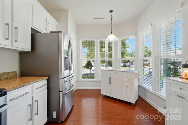 9003 Smokey Hill Ln, Fort Mill, SC 29707 - kitchen with healthy amount of natural light, dark wood-type flooring, stainless steel refrigerator with ice dispenser, and white cabinets