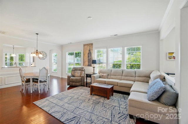 9003 Smokey Hill Ln, Fort Mill, SC 29707 - living area with crown molding, wood finished floors, and a chandelier