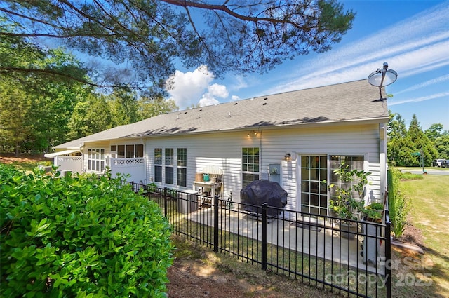 9003 Smokey Hill Ln, Fort Mill, SC 29707 - back of property with fence, a shingled roof, and a patio area