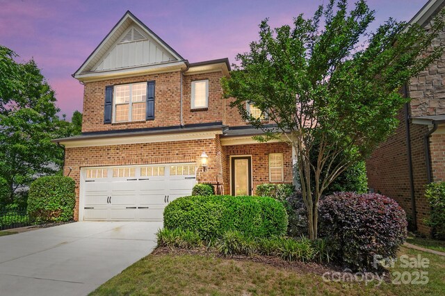 9735 Wheatfield Rd, Charlotte, NC 28277 - traditional-style home featuring brick siding, driveway, board and batten siding, and an attached garage