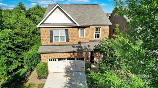 9735 Wheatfield Rd, Charlotte, NC 28277 - view of front of house featuring brick siding, a garage, concrete driveway, and roof with shingles