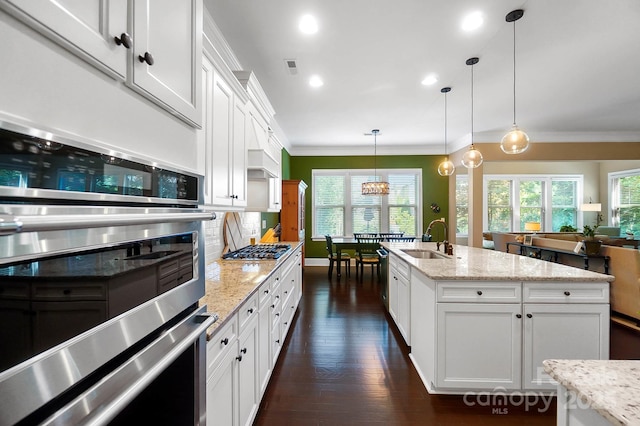 9735 Wheatfield Rd, Charlotte, NC 28277 - kitchen with a sink, crown molding, tasteful backsplash, dark wood-type flooring, and healthy amount of natural light