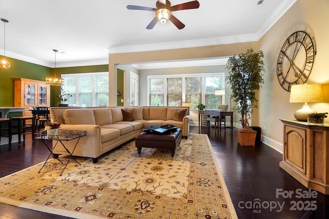 9735 Wheatfield Rd, Charlotte, NC 28277 - living room with plenty of natural light, crown molding, dark wood-type flooring, and a ceiling fan