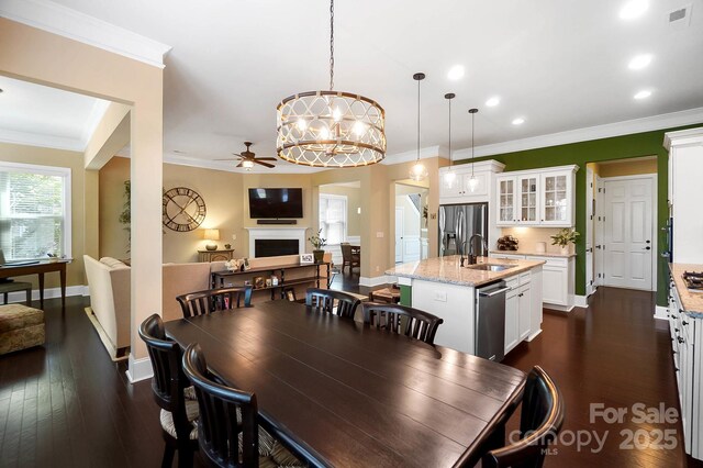 9735 Wheatfield Rd, Charlotte, NC 28277 - dining area featuring ceiling fan, baseboards, dark wood-style floors, recessed lighting, and crown molding