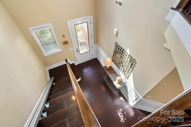9735 Wheatfield Rd, Charlotte, NC 28277 - staircase featuring wood finished floors and a high ceiling
