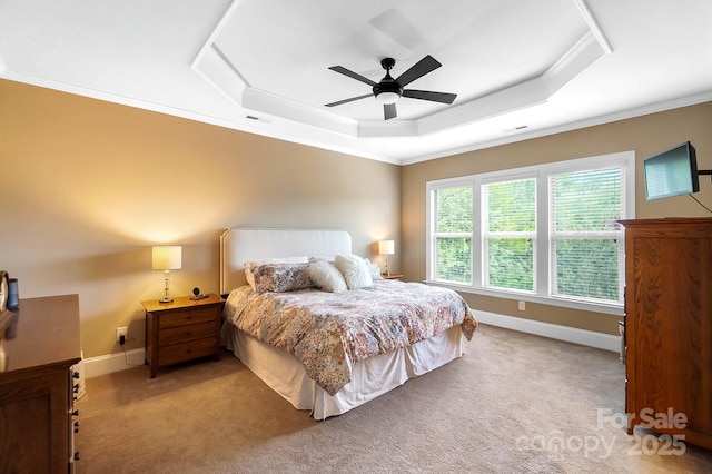9735 Wheatfield Rd, Charlotte, NC 28277 - bedroom featuring ornamental molding, light carpet, a tray ceiling, baseboards, and a ceiling fan