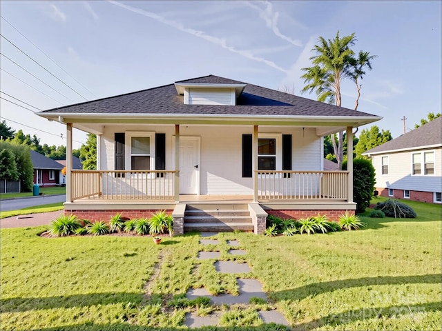 55 Ranlo Ave, Gastonia, NC 28054 - bungalow with covered porch, roof with shingles, and a front lawn