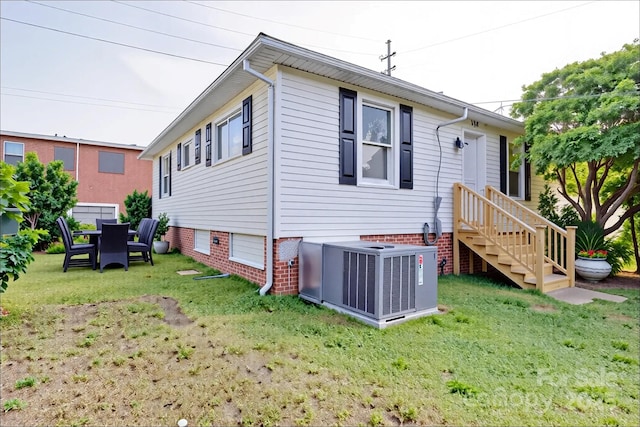 55 Ranlo Ave, Gastonia, NC 28054 - back of property featuring a yard and cooling unit