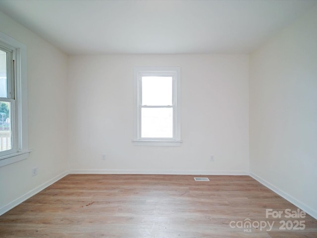 55 Ranlo Ave, Gastonia, NC 28054 - empty room featuring baseboards, visible vents, and light wood finished floors