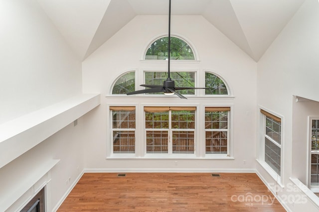 interior space with visible vents, ceiling fan, and wood finished floors